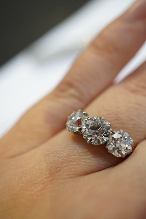 An attractive three-stone diamond ring, early 20th century